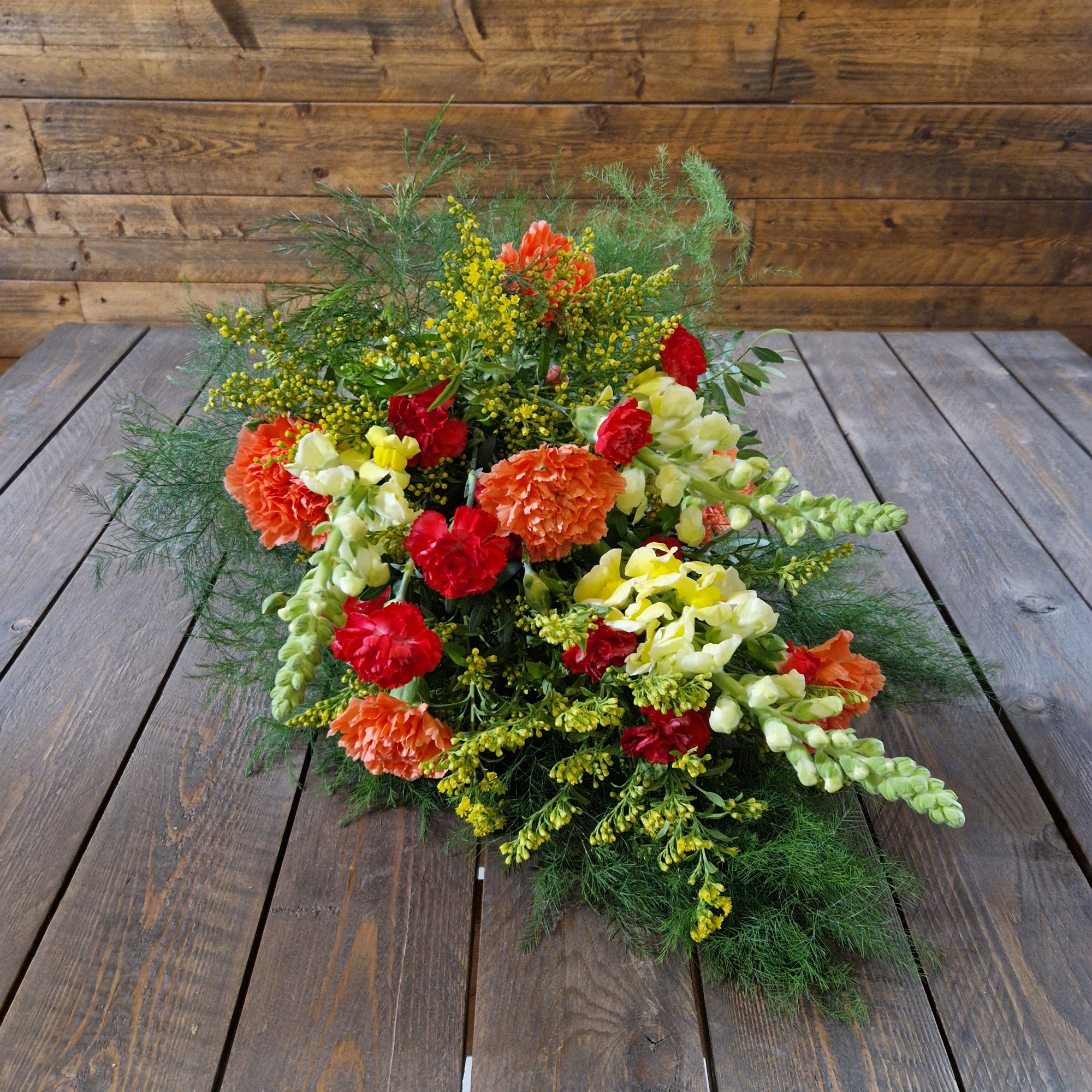 Begravning - Liggande bukett i gult och orange